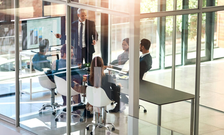 Presentation, charts and business people in meeting at office for corporate revenue, profit and finance data.