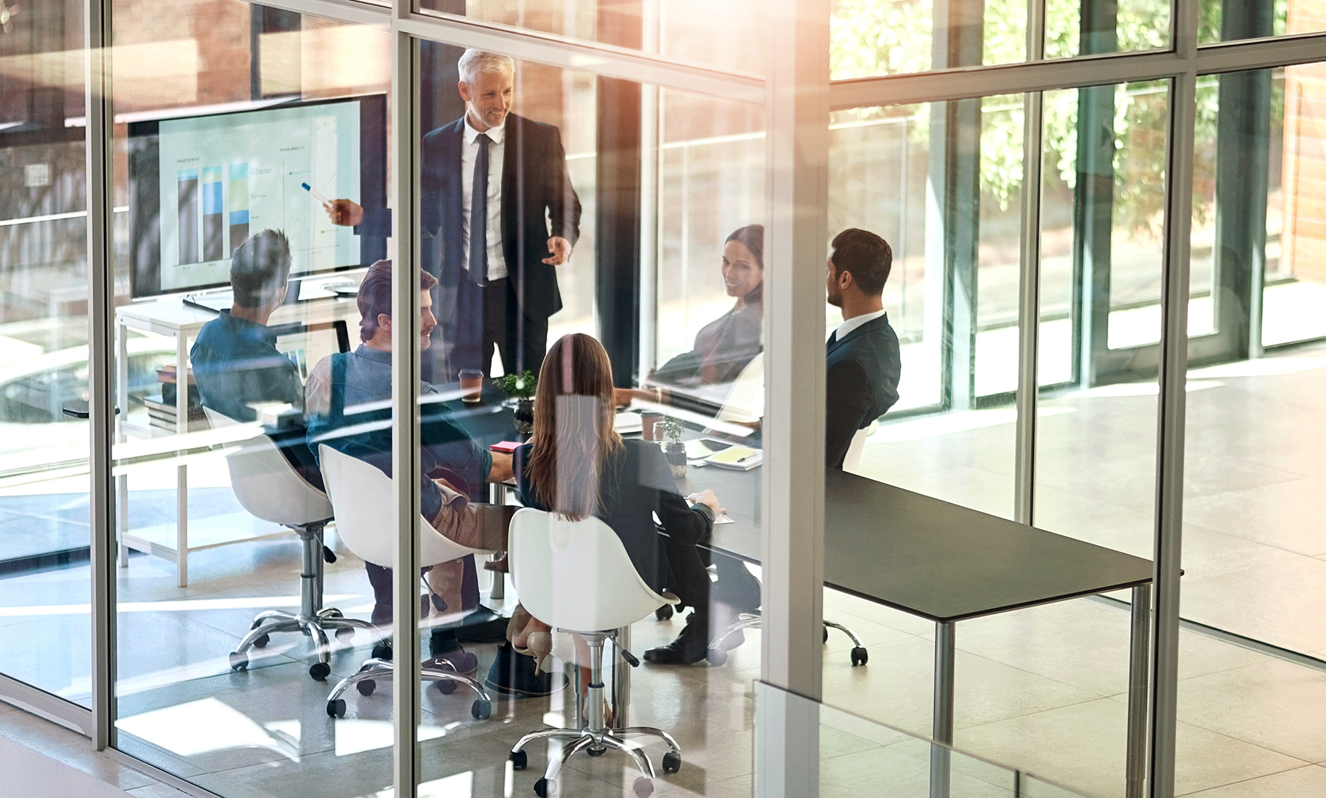 Presentation, charts and business people in meeting at office for corporate revenue, profit and finance data.